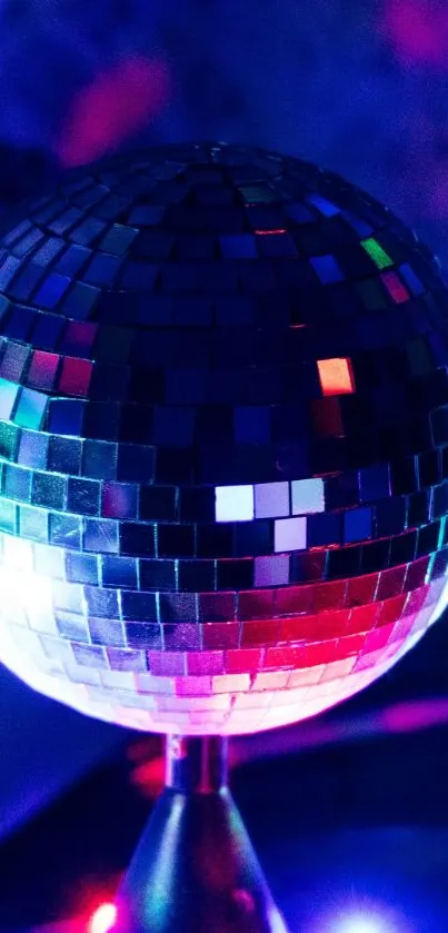 Disco ball with vibrant lights and colorful reflections.