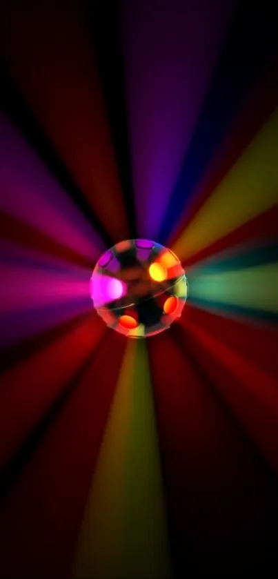 Vibrant disco ball with colorful light rays on dark background.