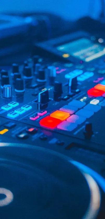 Colorful DJ mixing console at night, filled with lights.