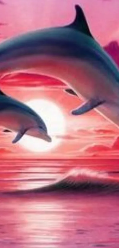 Dolphins jumping against a vibrant pink sunset over the ocean.