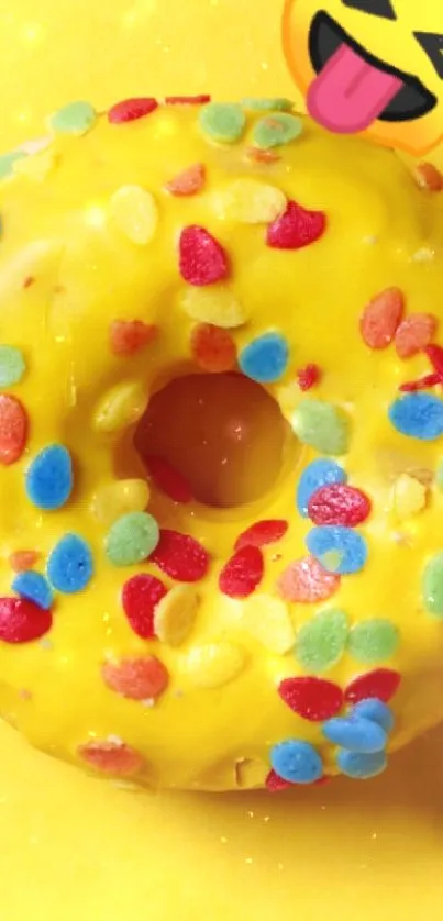 Bright yellow donut with emoji and colorful sprinkles wallpaper.