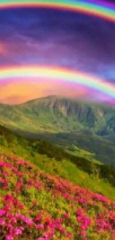 Double rainbow over lush green hills under a colorful sunset sky.