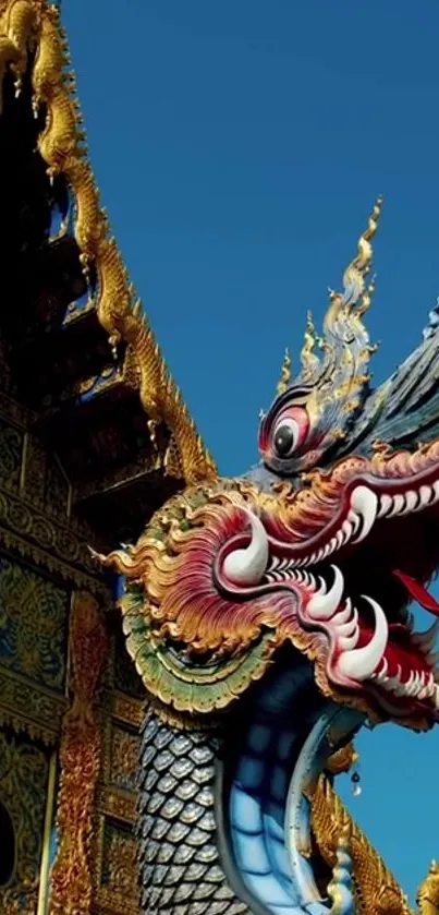 Intricate dragon sculpture with vibrant colors on a temple background.