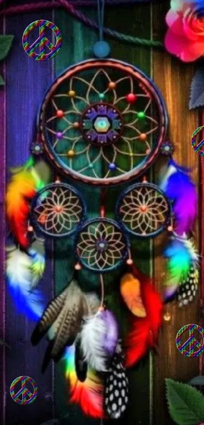 Colorful dreamcatcher mobile wallpaper with feathers and floral accents.