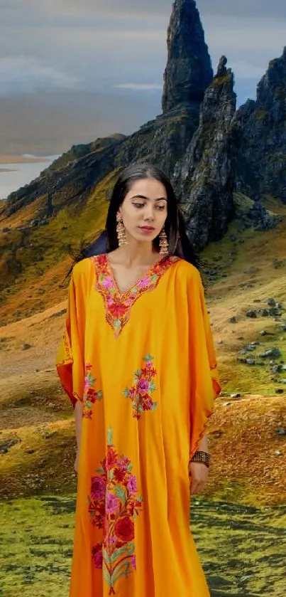 Woman in vibrant dress with mountain landscape backdrop.