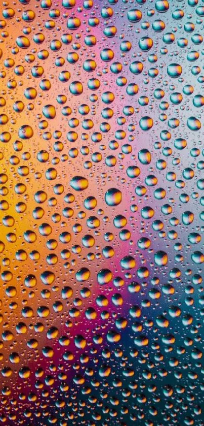 Vibrant water droplet wallpaper with orange, yellow, and blue colors.