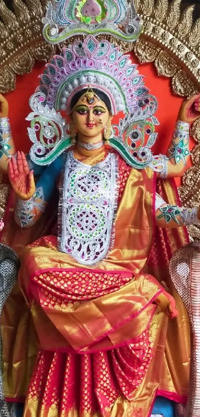 Vibrant Durga idol with intricate details showcased in a colorful setting.