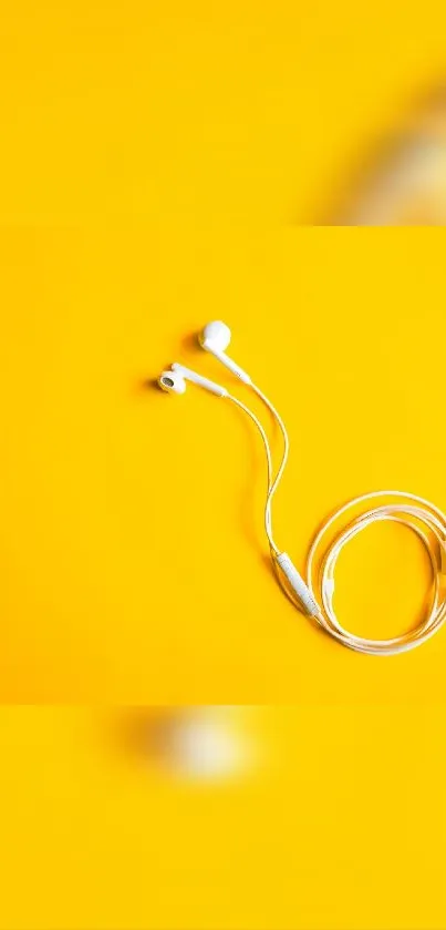 White earphones on a vibrant yellow background.