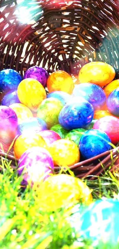 Vibrant Easter eggs in a woven basket on green grass.