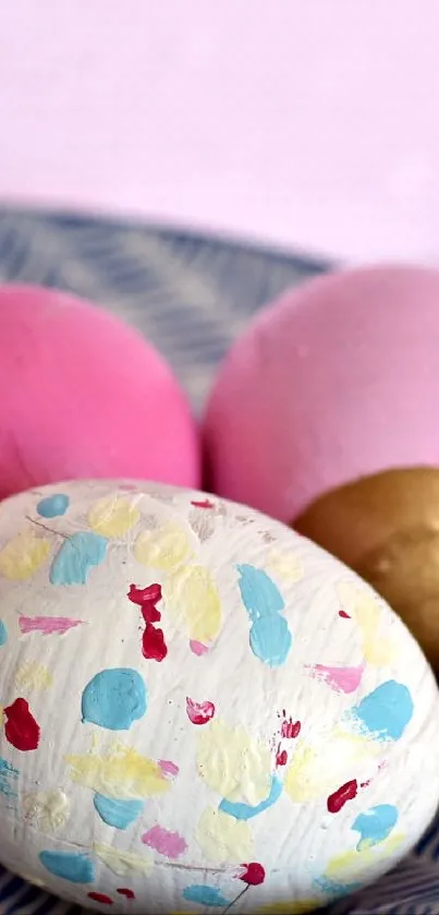 Colorful Easter eggs on a blue patterned dish.