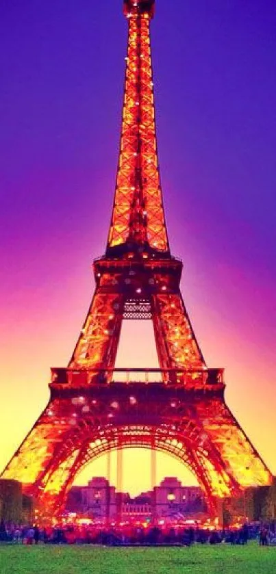 Stunning Eiffel Tower at sunset with vibrant purple and orange sky.