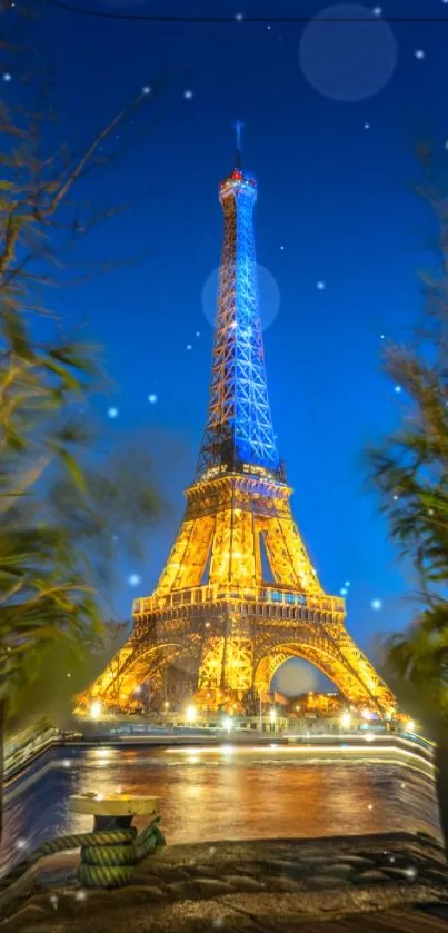 Eiffel Tower illuminated at night in Paris with vibrant blue and golden hues.