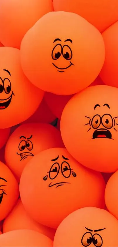 Orange emotive balls with cartoon faces displaying various expressions.