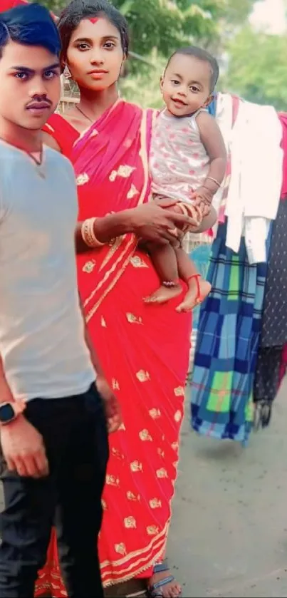 Family in vibrant traditional attire outdoors.