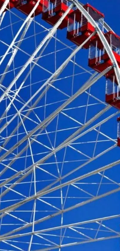 Ferris wheel against a bright blue sky.