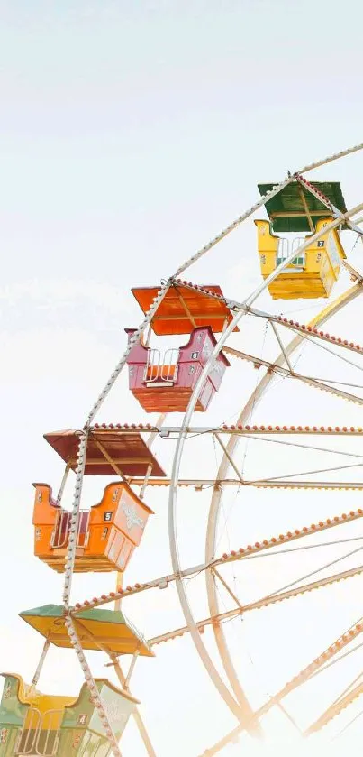 Vibrant Ferris wheel in bright sky wallpaper.