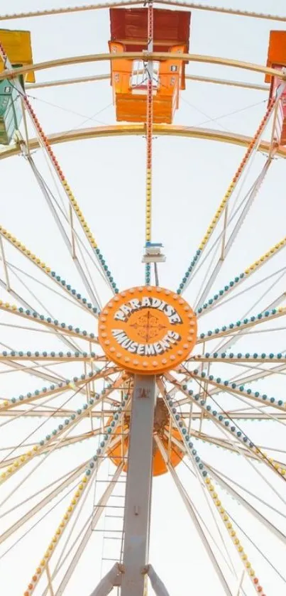 Colorful Ferris wheel under a clear sky, perfect for mobile wallpaper.