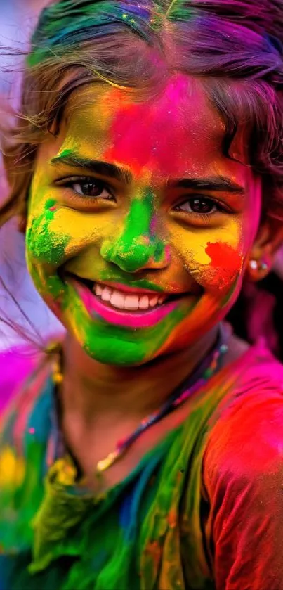 Smiling girl with vibrant colors on her face, celebrating a festival.