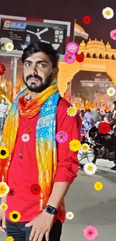 Man on vibrant festival street with colorful decorations.