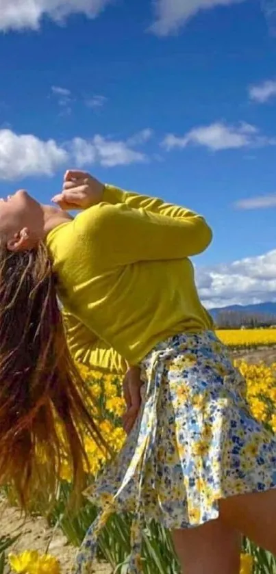 Woman in yellow dress enjoying sunshine in a field of flowers.