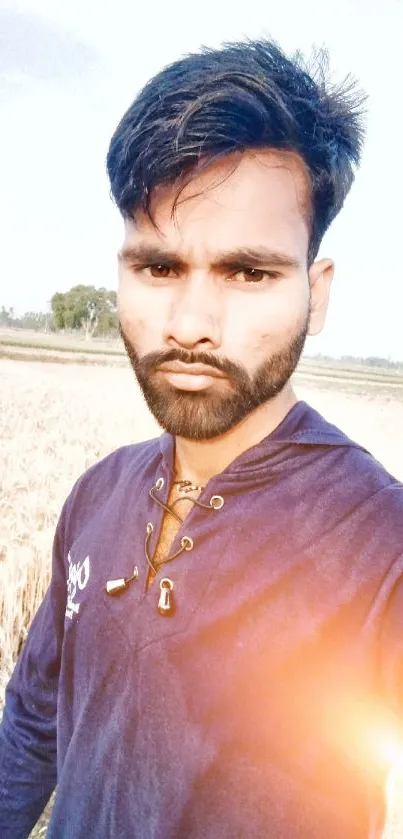 Stylish portrait in vibrant field during sunrise backdrop.