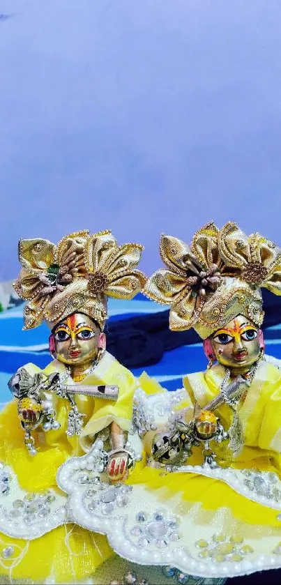 Ornate figurines in yellow attire with elegant detailing.