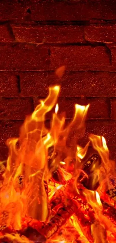 Blazing orange fire against rustic brick wall background.