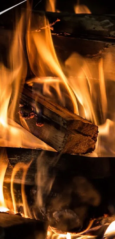 Mobile wallpaper of vibrant orange flames and burning firewood.