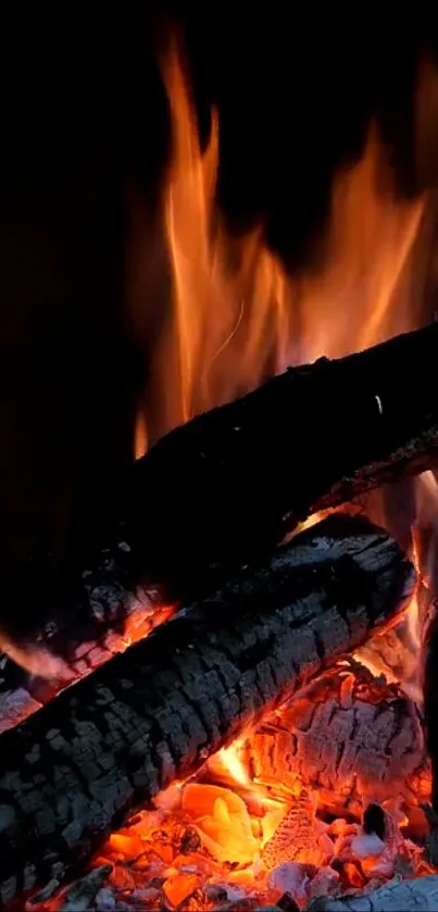 Vibrant orange flames and logs in a dynamic fire wallpaper.