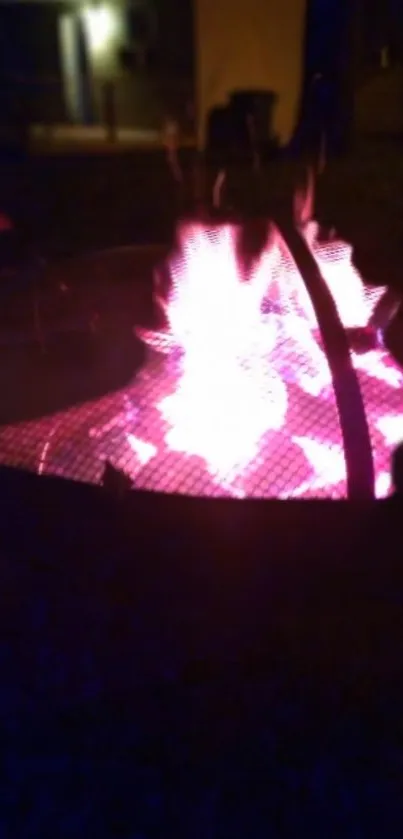 Vibrant fire pit glows with a pink hue.