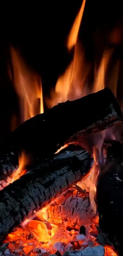 Glowing flames and logs in a vibrant fireplace wallpaper.