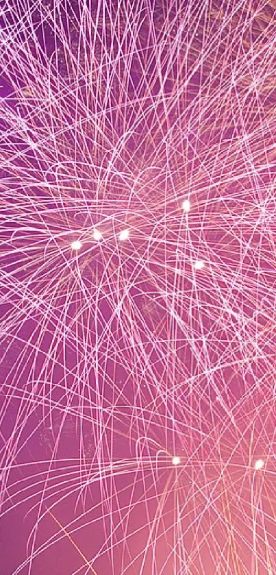 Purple and orange fireworks light up the night sky in a vibrant display.