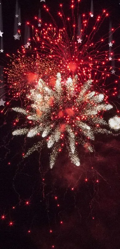 Red and white fireworks bursting in a dark sky.