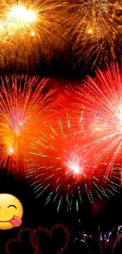 Colorful fireworks display with vibrant explosions of red, orange, and pink.