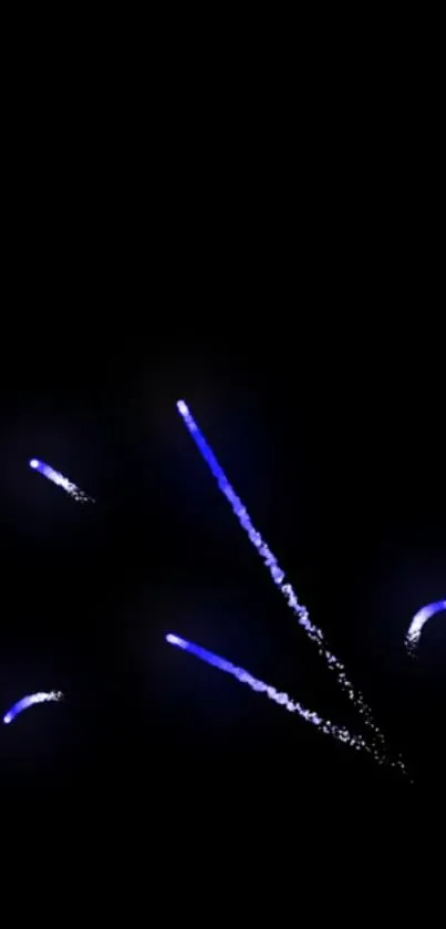 Blue fireworks illuminate night sky on phone wallpaper.