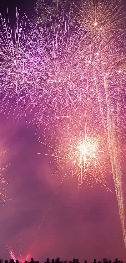 Vibrant fireworks illuminating a night sky with purple hues.