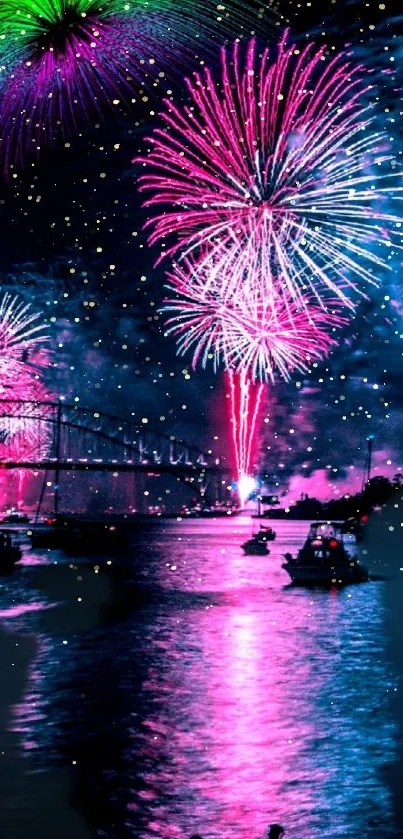 Vibrant pink and blue fireworks over water at night.