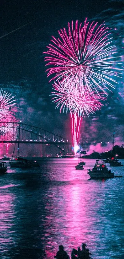 Pink fireworks illuminate the night sky over a tranquil lake.