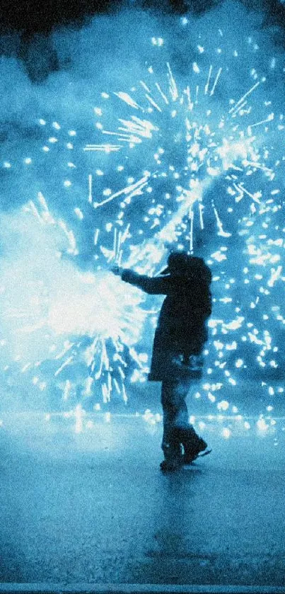 Silhouette amidst vibrant blue fireworks display.