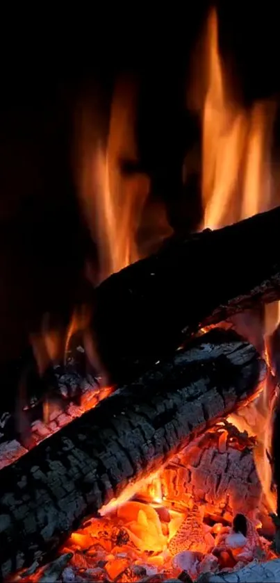 Vibrant wallpaper of burning logs with glowing flames.