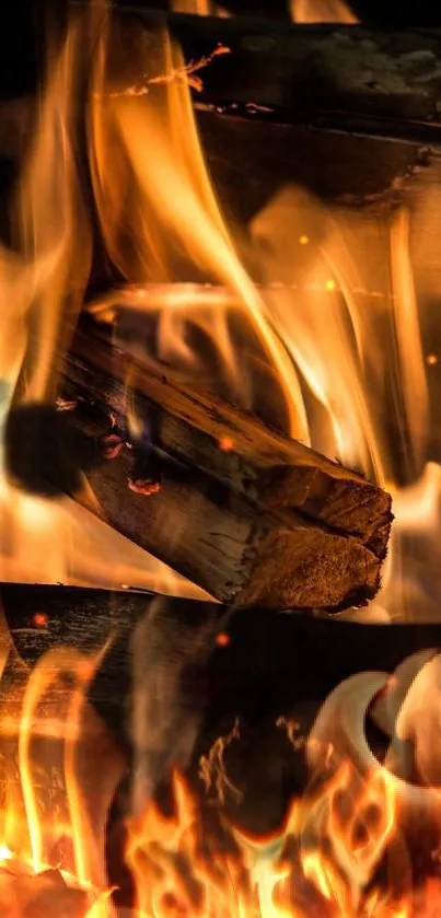 Close-up of vibrant orange flames and burning wood for phone wallpaper.