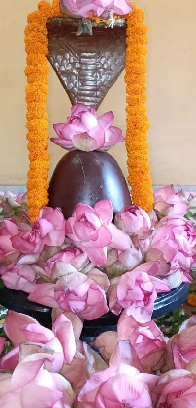 A serene altar with lotus and marigold garlands on a shivling.