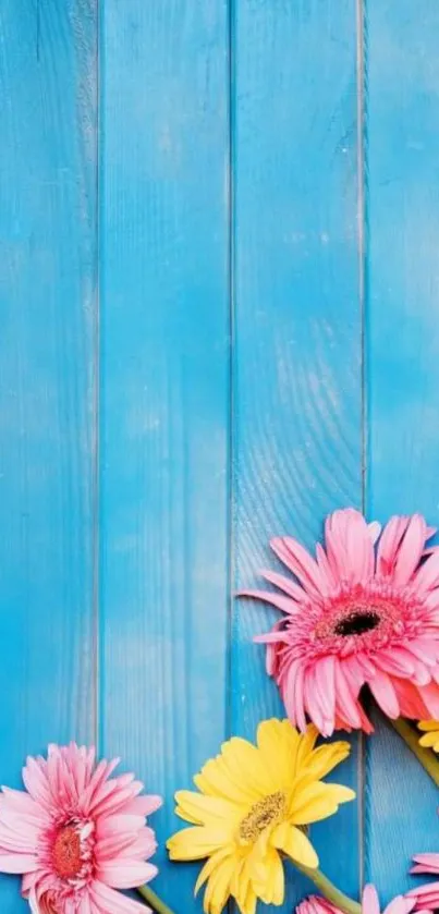 Vibrant blue background with colorful flowers on wooden panels.