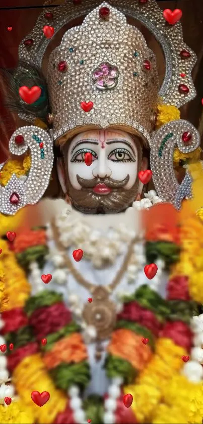 Deity in ornate attire with flowers and hearts, vibrant colors.