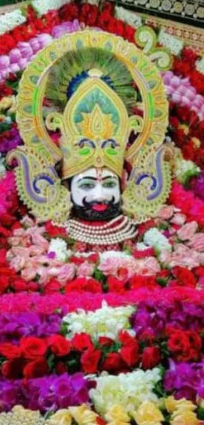 Vibrant deity amidst colorful flowers in a mobile wallpaper.