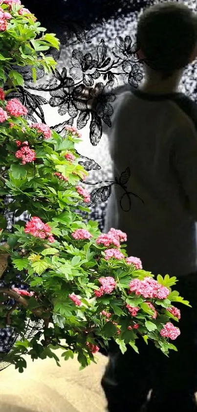 Green foliage with pink flowers against a mystical background.