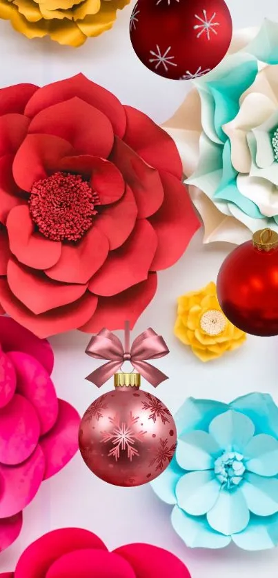 Vibrant red paper flowers with holiday ornaments.