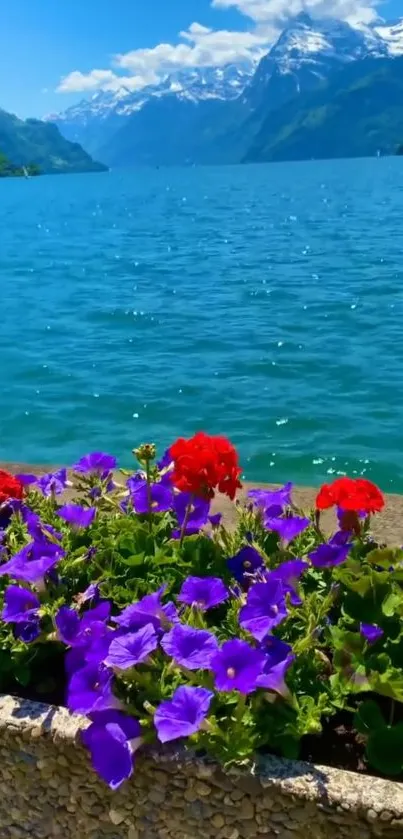 Vibrant lake scene with colorful flowers and mountains.