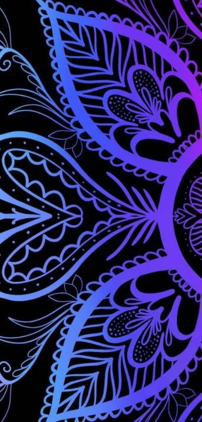 Vibrant mandala pattern with blue and purple floral design on a black background.