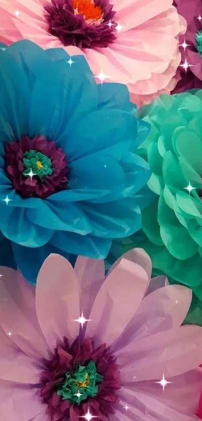 Colorful paper flowers in teal, pink, and purple hues.